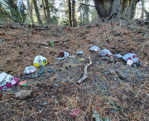 Rocks painted to look like campervans and Kombis