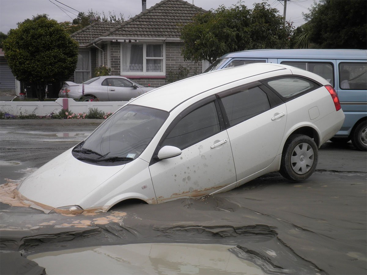 This photo of a white car in a silt hole was later used on the Police website