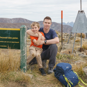 Author Mark Lincoln on a hill with his son