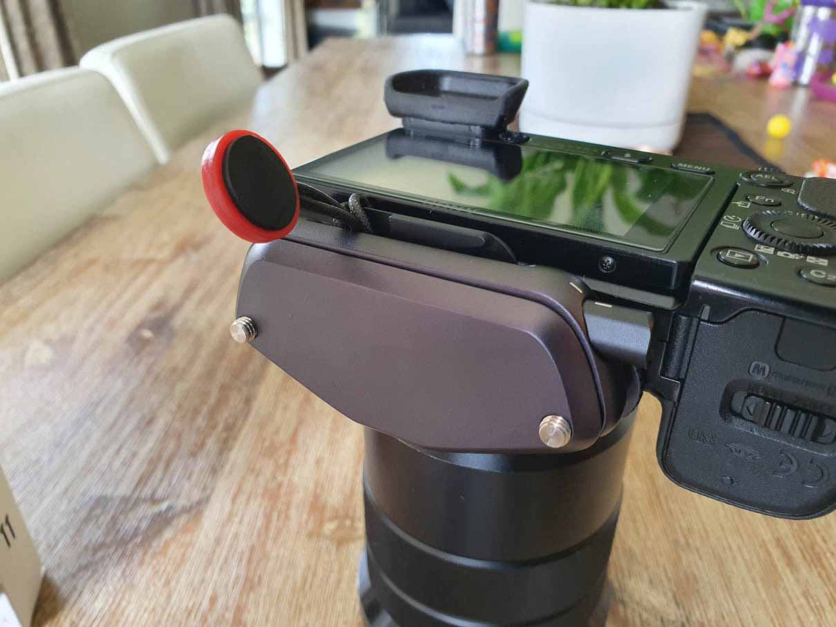 Capture Clip attached to the plate with a strap attachment on