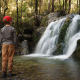 Family at a waterfall in New Zealand's South Island