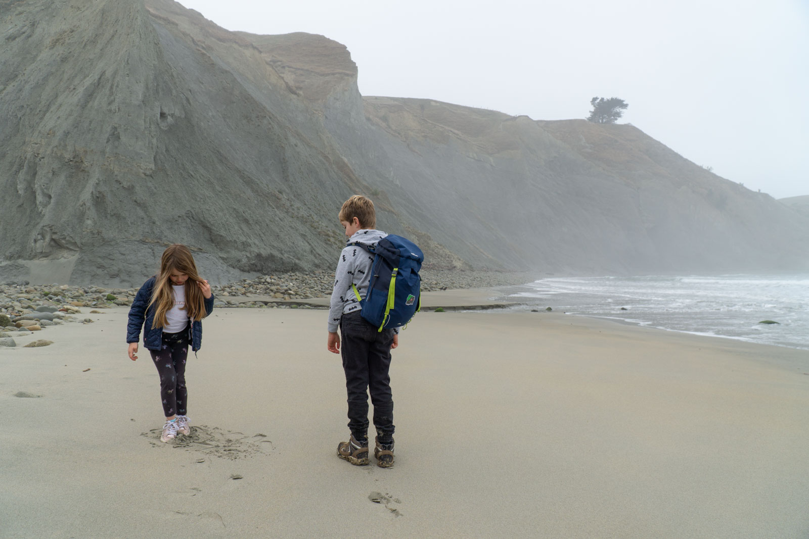 Children walk on MacKintosh Beach